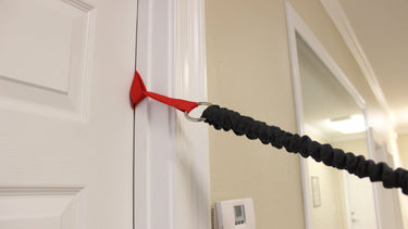 Door Hinge Anchor with Ring for clips or any resistance band. Fits around bars, poles, door knobs, door hinges and more.
